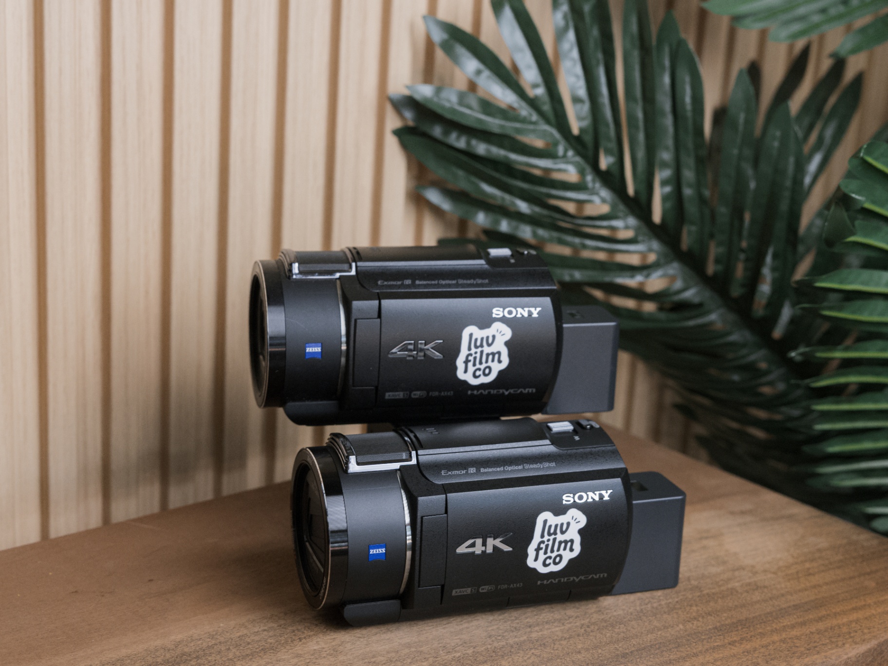 Two Sony 4K camcorders with Luv Film Co stickers